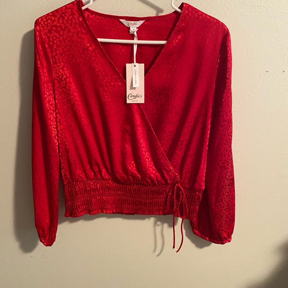 Red top, polyester and spandex , size small